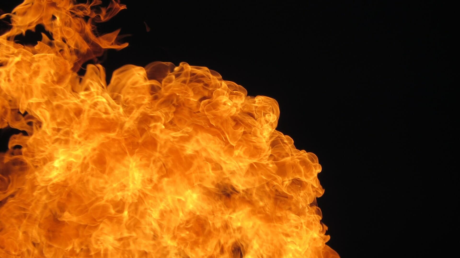 A close up of a fire on a black background.