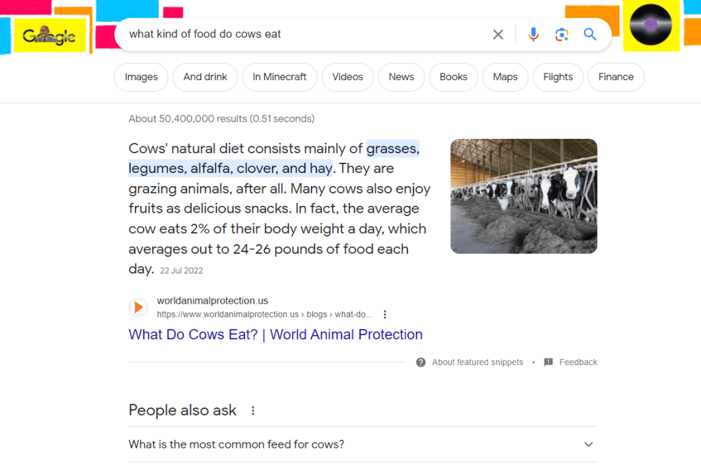 A google search page with a picture of a cow in a barn, demonstrating keyword search intent.